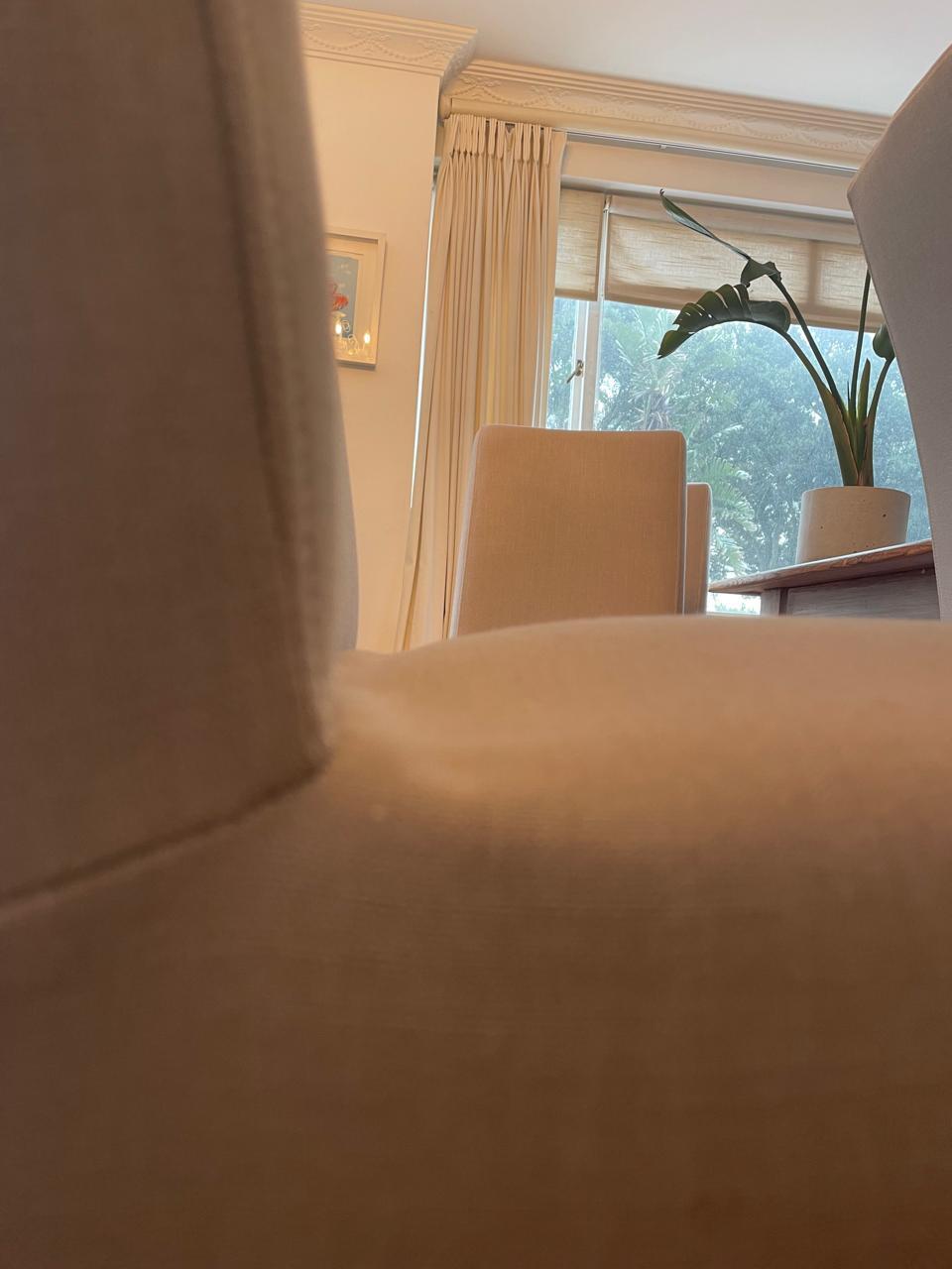 Dining chair seat and back junction photographed from below