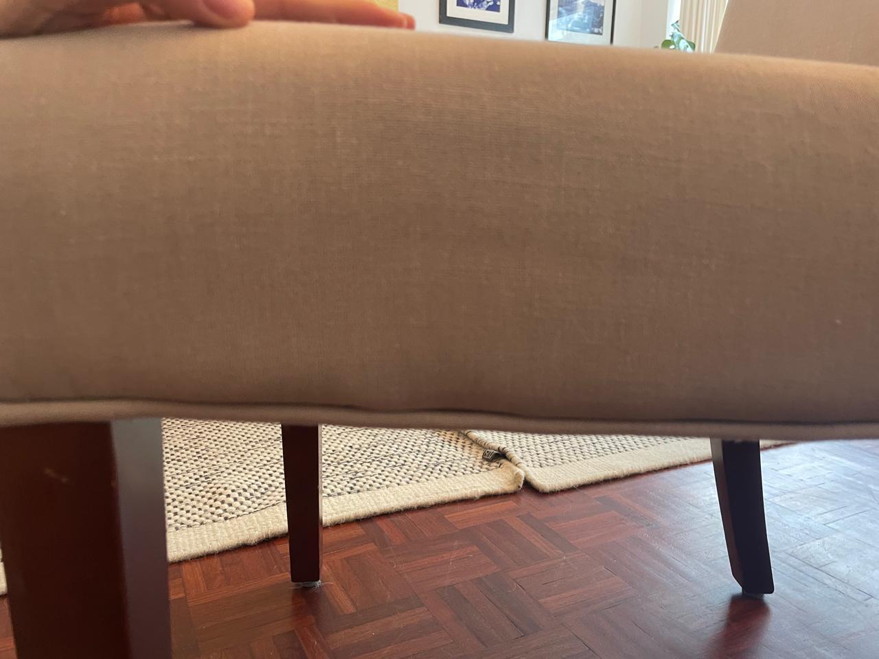 Lower back edge of an upholstered dining chair