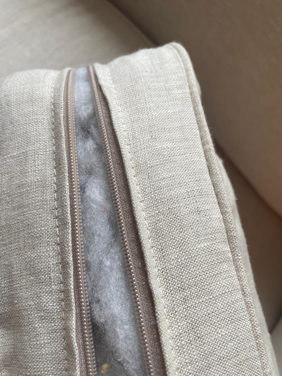 Open sofa cushion zip showing loose filling