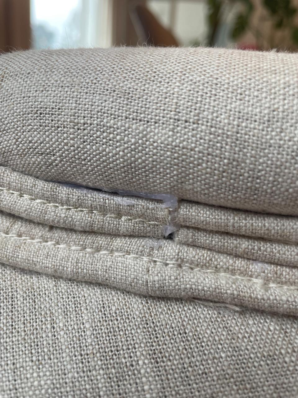 Close-up of sofa cushion zip and edge finishing